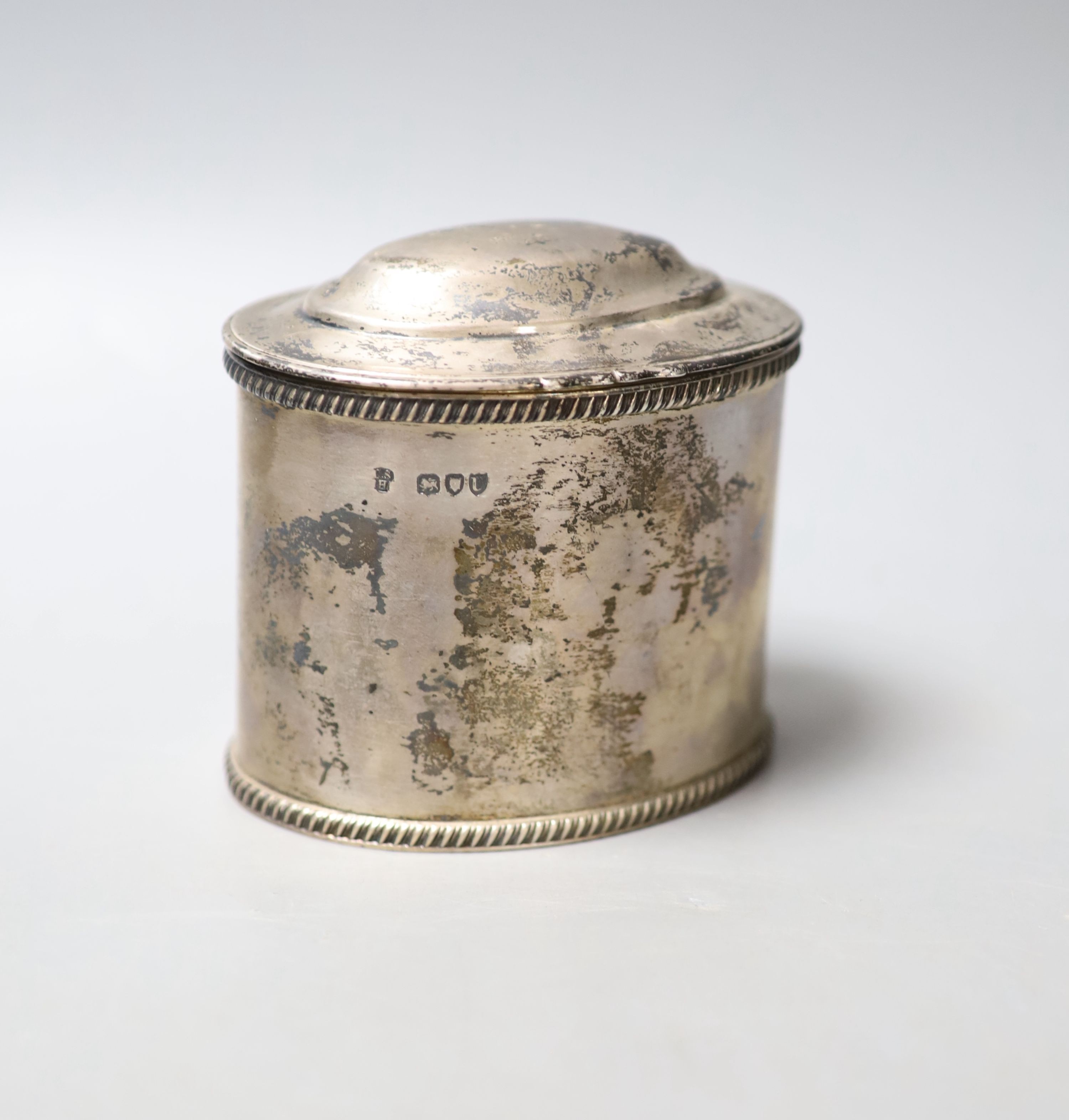 A late Victorian silver oval tea caddy, with gadrooned borders and hinged cover, Charles Stuart Harris, London, 1895, width 10.8cm, 9.5oz.